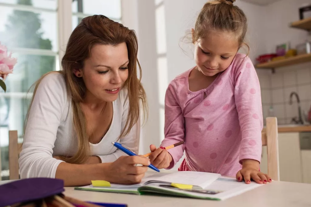 mother and daughter engaged in reading